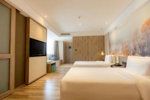 TV a/nebo společenská místnost v ubytování Atour Hotel Hongqiao Hub National Exhibition Center Shanghai