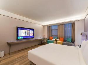 Fotografie z fotogalerie ubytování 郑州东站万象城酒店 v destinaci Xingzhuang