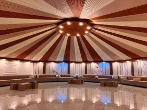 a large room with couches and a large ceiling at Rum Star Desert Camp in Wadi Rum
