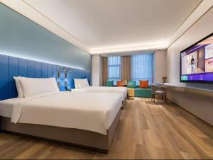 Fotografie z fotogalerie ubytování 郑州东站万象城酒店 v destinaci Xingzhuang + 3 fotografie