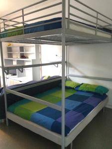 a bedroom with two bunk beds in a room at La Torre Casa Vacanze in Bergamo