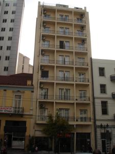 an apartment building with balconies on the side of it at Elite Hotel in Athens