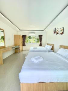 Postel nebo postele na pokoji v ubytování Le poulet poolvilla khanom + 34 fotografií