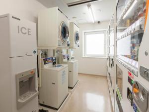 a laboratory with multiple machines in a room at Comfort Hotel Kitami in Kitami