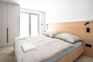 En eller flere senge i et værelse på Boutique hotel Vila Mudaj