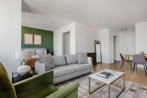 a living room with a couch and a bed at Tribeca Studio w Pool Gym View nr City Hall NYC-312 in New York