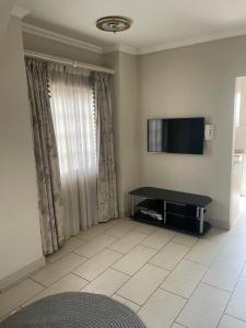 TV/trung tâm giải trí tại Cottage apartment