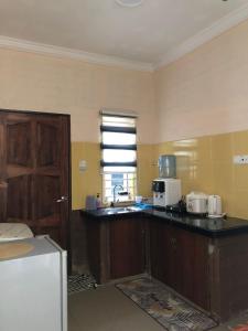 Η κουζίνα ή μικρή κουζίνα στο The Pura Rimba Residences Langkawi