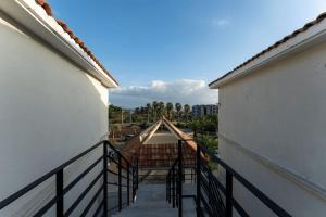 a balcony with a view of a building at Jeju Daonjae Sagye Branch in Seogwipo