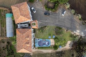 an overhead view of a large house with a yard at Jeju Daonjae Sagye Branch in Seogwipo +6 photos
