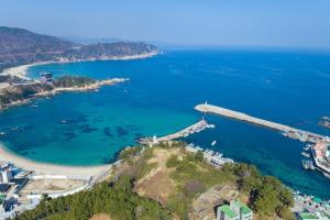 an aerial view of a bridge over a body of water at Janghohang Ilmare Pension in Samcheok