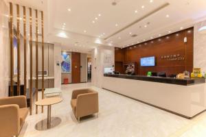 a lobby of a hotel with a reception desk at City Comfort Inn Wuhan Rui'an Street Metro Station in Wuhan