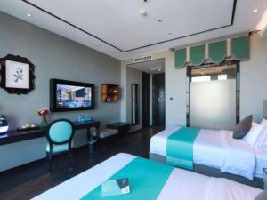 Postel nebo postele na pokoji v ubytování Xana Hotelle Yinchuan Swan Lake Wangfujing + 232 fotografií