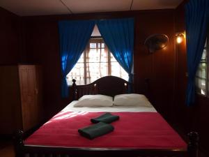 Ένα ή περισσότερα κρεβάτια σε δωμάτιο στο Palm Point Village