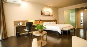 Ένα ή περισσότερα κρεβάτια σε δωμάτιο στο Jinjiang Inn select Hotel Kunming Economic Development Zone Kunming College +66 φωτογραφίες