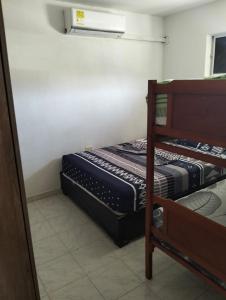 Giường trong phòng chung tại La casa de la abuela cartagena