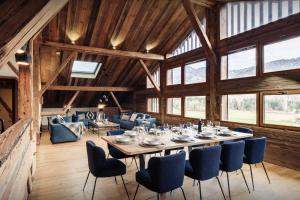 a large dining room with a table and chairs at Chalet Trumont - OVO Network in Morillon
