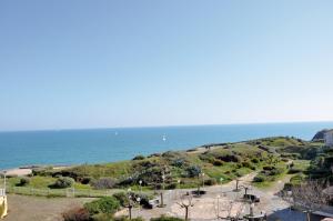 a view of the ocean from a building at Résidence Thalacap in Cap d'Agde