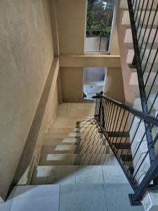 a staircase in a building with a stair case at Urban Oasis Residence in Nugegoda
