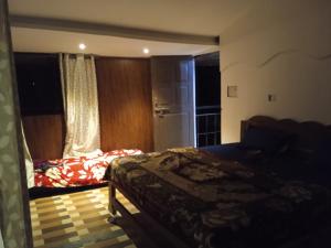 a bedroom with a bed and a window at RivoGoa riverside Homestay in Bardez