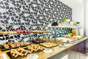 a buffet table filled with lots of different types of desserts at Eurostars Executive in Barbera del Valles