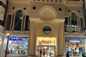 a store front of a shopping mall at night at Salam Baku Hotel (SBH) in Baku