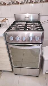 a stainless steel stove top oven in a kitchen at Unique and quiet TROPICKÝ PRÁZDNINOVÝ DŮM in Punta Cana