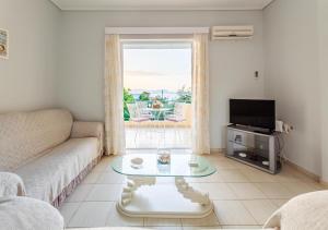 Μια τηλεόραση ή/και κέντρο ψυχαγωγίας στο Seaview Terrace Haven-Perfect Location By The Sea