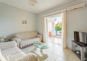 Μια τηλεόραση ή/και κέντρο ψυχαγωγίας στο Seaview Terrace Haven-Perfect Location By The Sea