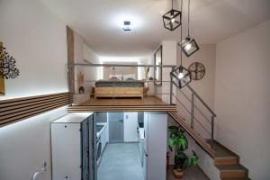 a room with a bed on the top of the stairs at Loft 53 - Twin Loft II by ΜΡS in Athens +39 photos