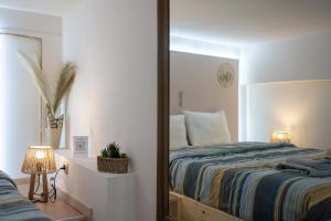 a bedroom with a large mirror and a bed at Loft 53 - Twin Loft II by ΜΡS in Athens
