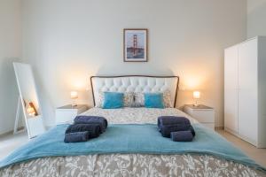 Giường trong phòng chung tại Maison Rosaria Free Parking Allianz