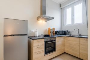 Nhà bếp/bếp nhỏ tại Maison Rosaria Free Parking Allianz +14 ảnh