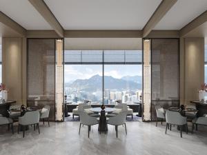 a restaurant with tables and chairs and a large window at Kobe Marriott Hotel in Kobe +81 photos