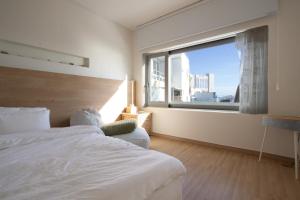 Ένα ή περισσότερα κρεβάτια σε δωμάτιο στο YeoulHyang, and DamㅣYeoulHyangㅣ +36 φωτογραφίες