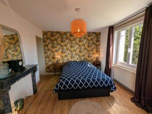 Ένα ή περισσότερα κρεβάτια σε δωμάτιο στο Chambre 2 Le Domaine des Vignes