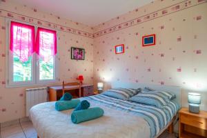 Ένα ή περισσότερα κρεβάτια σε δωμάτιο στο Hortensia 10 - 700 m de la plage