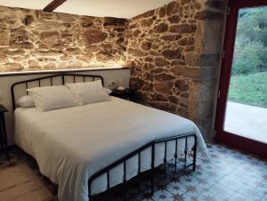 En eller flere senge i et værelse på Casa do Mao