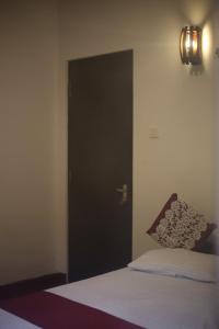 Ένα ή περισσότερα κρεβάτια σε δωμάτιο στο Sea side nest