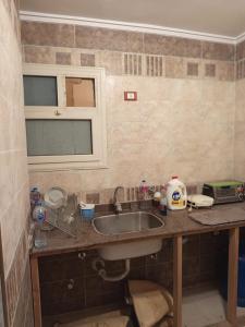 Una cocina o kitchenette en down town besaid auc