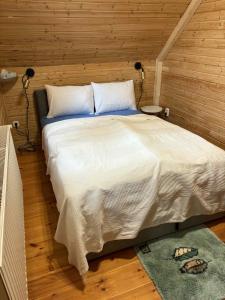 Ένα ή περισσότερα κρεβάτια σε δωμάτιο στο Colorful Life by STN