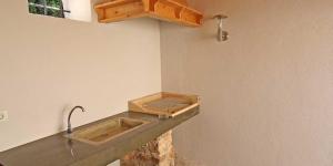 a kitchen counter with a sink and a tap at Mariana B4 in Veli Lošinj +52 photos