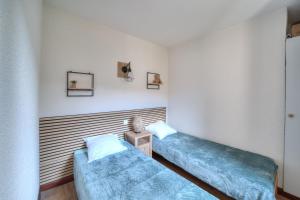 Ένα ή περισσότερα κρεβάτια σε δωμάτιο στο Chez Arnaud - Télésiège à 200 mètres