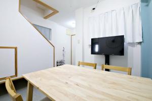 TV a/nebo společenská místnost v ubytování 壺屋戸建て Tsuboya House