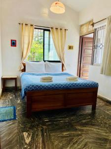 Ένα ή περισσότερα κρεβάτια σε δωμάτιο στο Peravel Beach Holiday Home