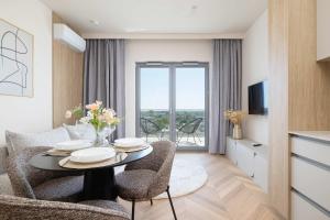 Μια τηλεόραση ή/και κέντρο ψυχαγωγίας στο Comfortable Studio in Katowice with Gym Sauna & Cinema by Noclegi Renters