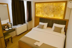 Postel nebo postele na pokoji v ubytování CALENBERG HOTEL