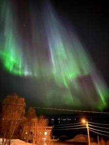 an image of the northern lights in the sky at Aurora Borealis Apartment - Sleeps 3 - Parking in Hjorten