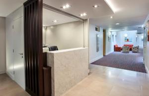 a lobby with a reception counter and a waiting room at Cordia Serviced Apartments in Belfast