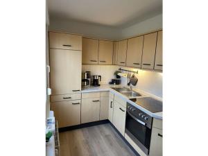 Η κουζίνα ή μικρή κουζίνα στο Anchorage Modern retreat